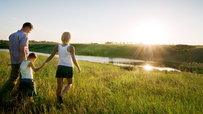 Image of family looking across landscape